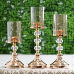 Gold Metal Pillar Candle Holder With Hurricane Glass Tube & Crystal Globes 37 Gold Metal Pillar Candle Holder With Hurricane Glass Tube & Crystal Globes -Home Decor Promotional Store CHDLR CAND 021 GOLD SET D01