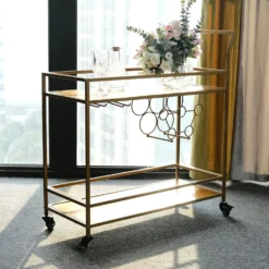Gold Metal 2-Tier Bar Cart Wine Rack With Wooden Serving Trays, Kitchen Trolley With 5 Wine Bottles & 2 Wine Glass Holder Rack 3ft -Home Decor Promotional Store FURN CART 003 GOLD D05.progressive 8124241e 5cb6 48a5 a56c e5b8d4405084