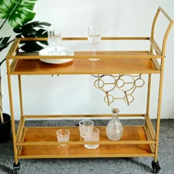 Gold Metal 2-Tier Bar Cart Wine Rack With Wooden Serving Trays, Kitchen Trolley With 5 Wine Bottles & 2 Wine Glass Holder Rack 3ft -Home Decor Promotional Store FURN CART 003 GOLD D09.progressive 49622f05 ead4 4c96 9ca7 14d8316631a5